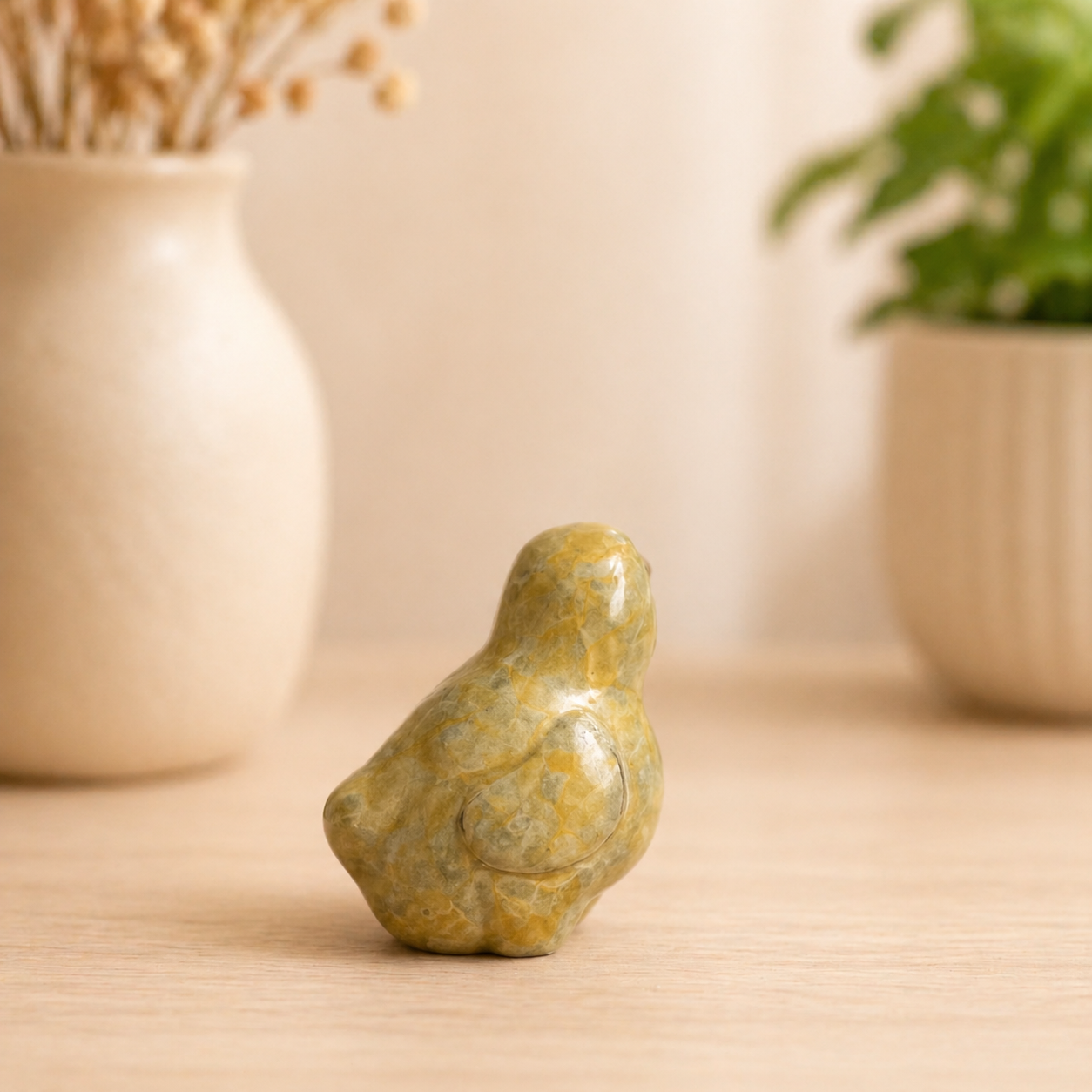 bronze sculpture of a chick